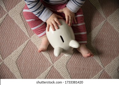 Financial Planning. Baby With A Piggy Bank Investing For Their Future