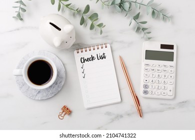 Financial Planning Checklist Concept With Calculator And Piggy Bank On Marble Table