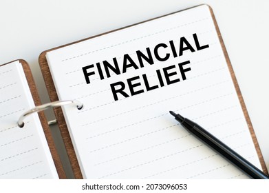 Financial Relief Text In Notepad On White Background