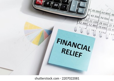 Financial Relief Text In Notepad On White Background