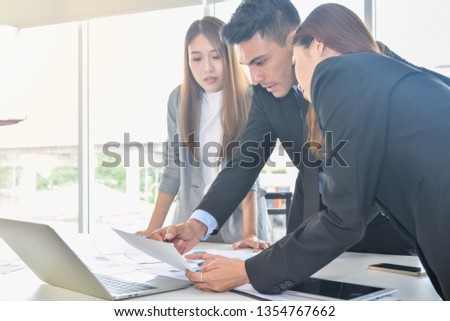 Financial report analysis and reviewing concept :CFO or chief financial officer sees financial summary reports with his secretary team and discusses about future growth and improvements
