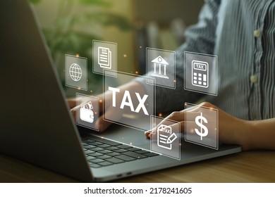 Financial research, government taxes, and calculation tax return concept. Business Woman using the laptop to fill in the income tax online return form for payment.Calculation tax return. tax and vat - Shutterstock ID 2178241605