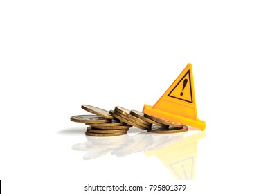 Financial Risk. Coins Falling And Warning Label On Whitebackground