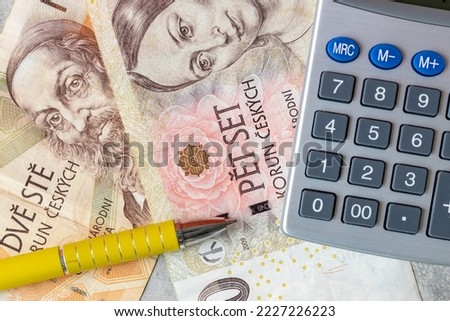 financial settlements in the Czech Republic, concept, 200 and 500 CZK banknotes lying around the calculator and yellow pen taxes in the Czech Republic, close-up view, top view Foto stock © 