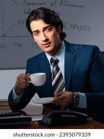 Financial specialist working late in the office - Shutterstock ID 2395079339