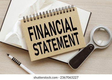 FINANCIAL STATEMENTS. craft notepad with a spring. text on the page - Shutterstock ID 2367063227