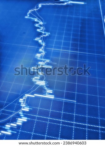 Financial statistic analysis on dark background with growing financial charts. Businessman analyzing forex trading graph financial data