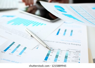 Financial Statistics Documents Ball Pen Infographics At Office Table Closeup. Internal Revenue Service Inspector Sum Check Investigation Exchange Market Earnings Savings Loan And Credit Concept