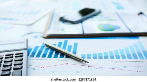 Financial Statistics Documents Ball Pen Infographics At Office Table Closeup. Internal Revenue Service Inspector Sum Check Investigation Exchange Market Earnings Savings Loan And Credit Concept