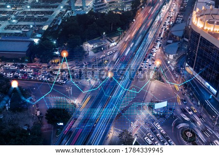 Financial stock chart hologram on top view of road, busy urban traffic highway at night. Junction network of transportation infrastructure. The concept of logistics and transactions. Stock photo © 