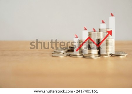 Financial Success Graph with pile of golden Coins on wooden desk with copy space , Chart, Percent symbol and red upward arrow.  Financial concept background.  
