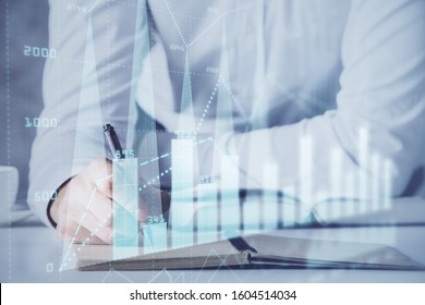 Financial trading chart multi exposure with man desktop background. - Shutterstock ID 1604514034