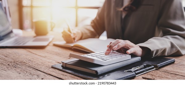 The financiers are calculating personal taxes for their customers. - Shutterstock ID 2190783443