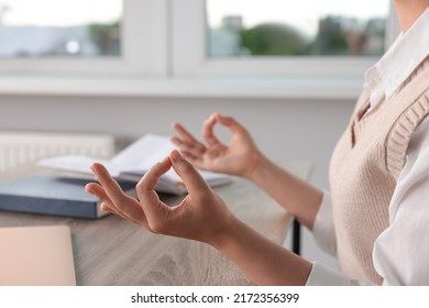 Find Zen. Woman Taking Break From Work At Table In Room, Closeup