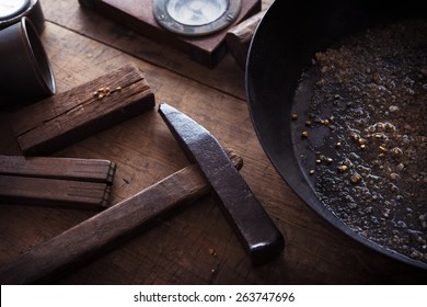 Finding Gold. Gold Panning, Digging Or Gold Prospecting. Gold On Wash Pan With Gold Prospecting Tools.