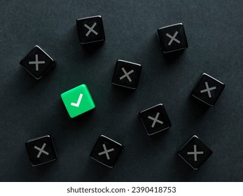 Finding the right solution or to find the correct answer. Approval. Voting yes. Best decision, choice or option. Check mark and cross symbols on black cubes.