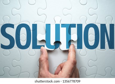 Finding solution to problem. Business solution concept.Connecting last jigsaw puzzle piece. 