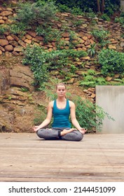 Finding Strength From Within. Shot Of A Young Woman Practicing Yoga Outdoors.