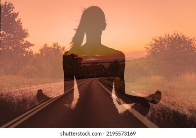 Finding your inner peace, getting away form it all, and free your mind concept. Woman meditating facing a empty country road.  - Shutterstock ID 2195573169