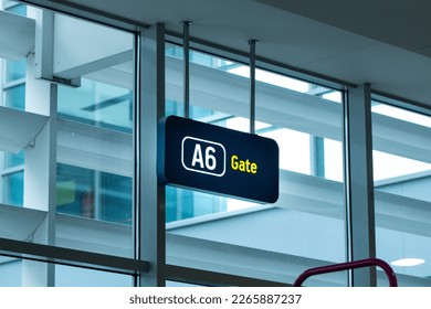 Finding Your Way: A Vibrant Image of a Gate Sign in the Airport - Perfect for Travel and Navigation Themes. Get Ready to Board Your Flight with This Clear and Easy-to-Read Sign Displaying Your Gate - Shutterstock ID 2265887237