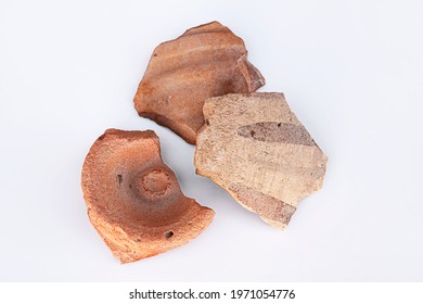 Finds of archaeologists. Shards of ancient ceramics. Artifacts from the ancient city. Drawings on ancient ceramics. Fragments of ancient pottery. History of the nomads. Archeology. White background