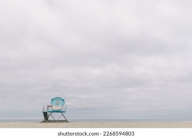 Fine art beach scene with lifeguard Tower and cloudy skies - Powered by Shutterstock