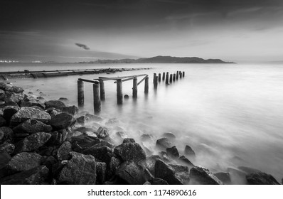 Fine art image in black & white of abandon jetty at Pulau Pinang island, Malaysia. Soft Focus due to long exposure. - Powered by Shutterstock