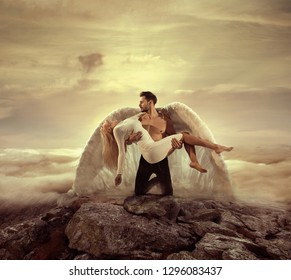 Fine art imagery. Woman and angel man embracing.