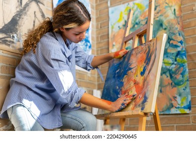 Fine Art Student Painting At Home In Her Room. 