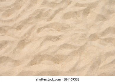 Fine beach sand in the summer sun - Shutterstock ID 584469382