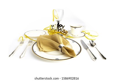 A Fine China Place Setting For New Years Eve Dinner Isolated On White