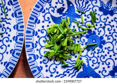 Fine China Plates With Freshly Cut Chives.