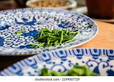 Fine China Plates With Freshly Cut Chives.