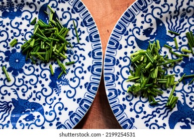 Fine China Plates With Freshly Cut Chives.