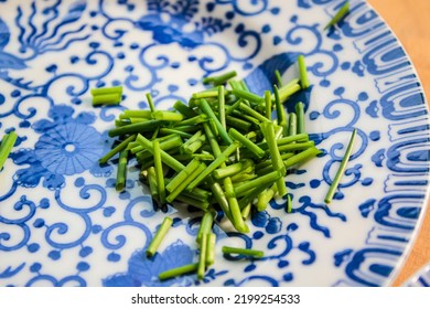 Fine China Plates With Freshly Cut Chives.