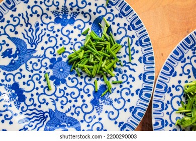 Fine China Plates With Freshly Cut Chives.