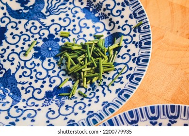 Fine China Plates With Freshly Cut Chives.