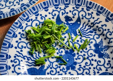 Fine China Plates With Freshly Cut Chives.