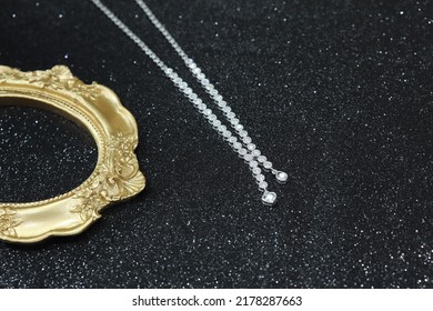 Fine Jewelry As Diamond Necklace With Diamond With Black Satin Fabric Background. Jewelry Shop Concept