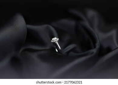 Fine Jewelry As Diamond Ring With Diamond With Black Satin Fabric Background. Jewelry Shop Concept