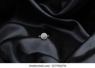 Fine Jewelry As Diamond Ring With Diamond With Black Satin Fabric Background. Jewelry Shop Concept