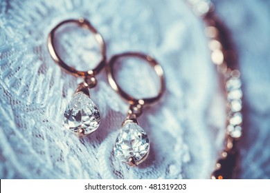 Fine Jewelry: Earrings On The White Wedding Dress