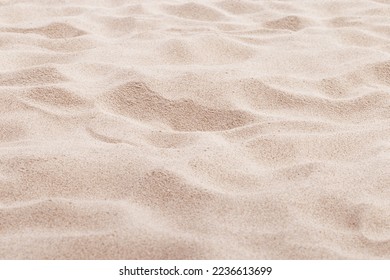 Fine Sand texture natural surface. Close up of sand on shore sea, white waves dunes, pink neutral color, minimal nature aesthetics wallpaper. Sandy beach for background, selective focus, copy space.