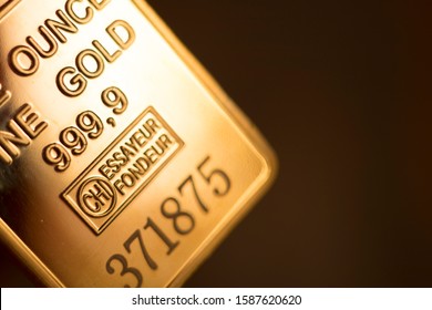 Fine Solid Gold 999.9 One Ounce Bullion Ingot Precious Metals Bar Closeup Isolated Photo.