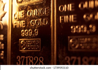 Fine Solid Gold 999.9 One Ounce Bullion Ingot Precious Metals Bar Closeup Isolated Photo.