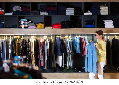 Fine Woman Shopping Casual Clothes In Modern Men Store