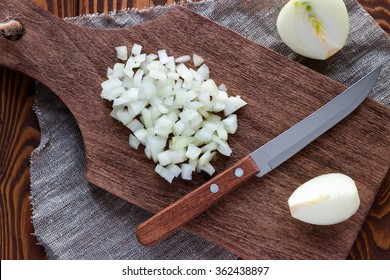 finely chopped onion on a cutting board