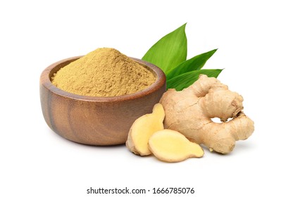 Finely dry Ginger powder in wooden bowl with  rhizome (root) sliced and green leaves isolated on white background. - Shutterstock ID 1666785076
