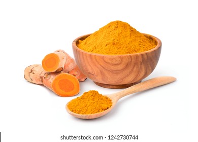 Finely dry Turmeric (Curcuma longa Linn) powder in wooden bowl and spoon with  rhizome (root) isolated on white background.