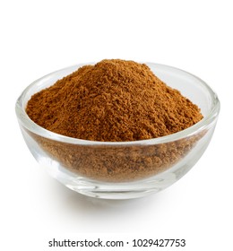 Finely Ground Cinnamon In Glass Bowl Isolated On White.